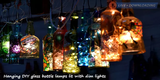 Hanging DIY glass bottle lamps lit with dim lights - Livedownloading